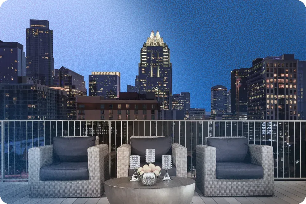 The rooftop terrace at the Hilton Austin, looking out over the downtown skyline at dusk