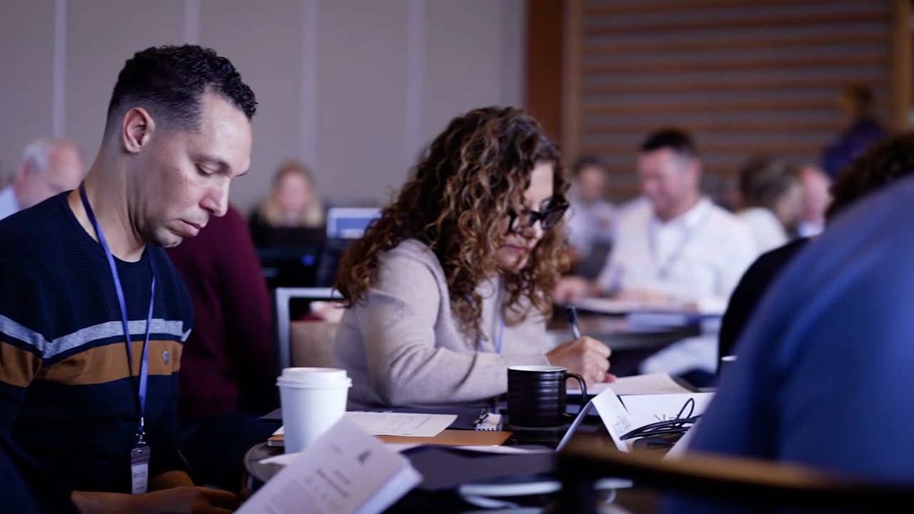 Leaders applying AI frameworks together during a working session